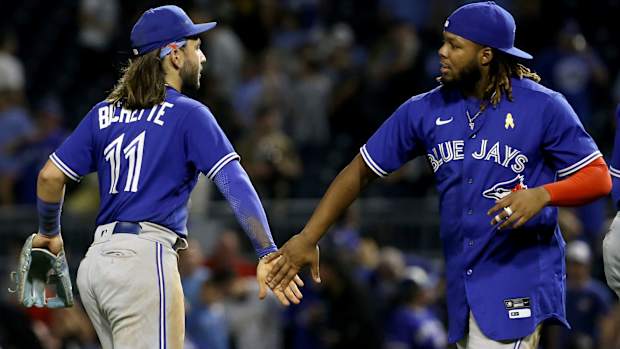 Bo Bichette and Vladimir Guerrero Jr. celebrate